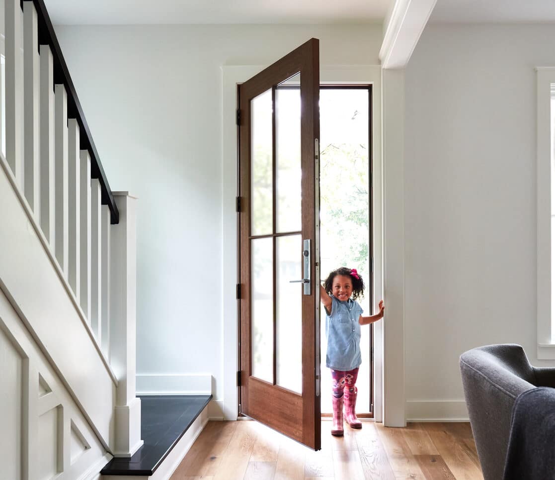 wooden entry door with glass inset