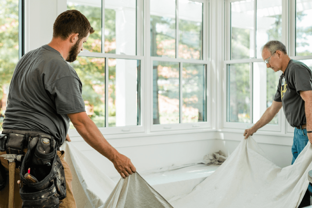 builder or contractor putting down protective cloth