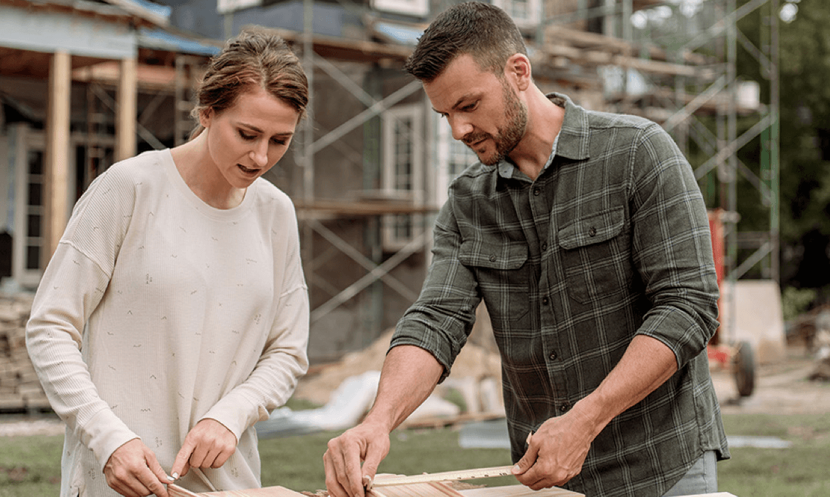 builder or couple measuring windows paid for by financing options